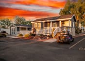 Thumbnail 1 of 26 - a home with a golf cart parked in front of it