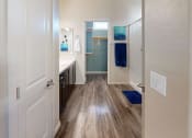 Thumbnail 10 of 33 - a bathroom with a sink and a mirror at Olive Queen Creek Apartments, Queen Creek, Arizona
