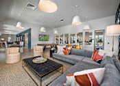 Thumbnail 21 of 40 - clubhouse with couch seating at The Cottages at Old Monrovia Apartment, Huntsville, AL, 35806