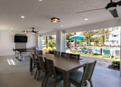 Thumbnail 28 of 51 - a view of a building with windows and a reflection at Enclave at 3230 Apartments, South Daytona