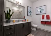 Thumbnail 13 of 51 - a bathroom with a sink and a toilet and a mirror at Enclave at 3230 Apartments, South Daytona, FL, 32119