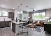 Thumbnail 8 of 51 - A modern kitchen with a dining area and a living room at Enclave at 3230 Apartments, South Daytona, 32119