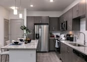 Thumbnail 3 of 51 - a kitchen with a counter top and a sink at Enclave at 3230 Apartments, South Daytona, FL