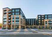 Thumbnail 48 of 54 - A modern multi-story building with a combination of beige and dark brown exterior. at The Arlow on Kellog, St. Paul, MN