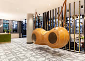 Thumbnail 10 of 19 - A large wooden structure in a room with a checkered floor.