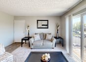 Thumbnail 10 of 35 - a living room with a couch and a coffee table at Park 88 Apartments, Colorado