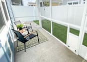 Thumbnail 9 of 46 - Patio with yard at Artesia at Lakewood Ranch Apartments, Bradenton, Florida