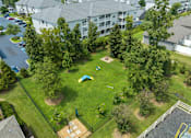 Thumbnail 32 of 40 - an aerial view of a backyard with a trampoline