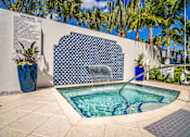 Thumbnail 29 of 34 - small pool  surrounded by blue mosaic tiles on wall at Magnolia Square, Naples, Florida