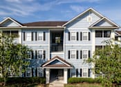 Thumbnail 25 of 26 - exterior building view of apartment complex at Magnolia Village Apartments, Jacksonville, FL