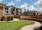Thumbnail 34 of 37 - an image of an apartment building with a golf course in front of it at Annandale Apartment Homes, Murfreesboro, TN