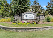Thumbnail 40 of 40 - a stone retaining wall with a sign in front of it that says the heaven lawn and garden