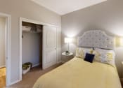 Thumbnail 13 of 44 - a bedroom with a bed and a closet with a door open