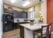 Thumbnail 5 of 44 - Clubhouse Kitchen at Solaire Apartments in Brighton, CO