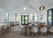 Thumbnail 33 of 40 - a living room with a large table and chairs at Odyssey, Florida