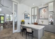 Thumbnail 30 of 40 - Office in resident clubhouse with a large white desk and two black chairs at Odyssey, Florida