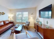 Thumbnail 4 of 19 - a living room with a leather couch  at Somerset Apartments, Florida, 33774