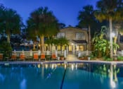 Thumbnail 16 of 19 - Pool In Night at Somerset Apartments in Largo, Florida