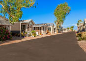 Thumbnail 4 of 26 - a row of houses on the side of a road