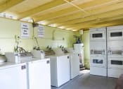 Thumbnail 16 of 18 - Laundry Room at Tan Tara