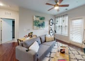 Thumbnail 5 of 39 - a living room with a couch and a coffee table at The Bend Arbordale, Williamsburg