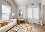 Thumbnail 7 of 40 - a living room with a white couch and a rug at The Cottages at Old Monrovia Apartment, Huntsville, AL, 35806
