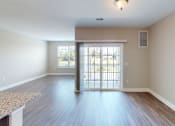 Thumbnail 18 of 33 - a bedroom with hardwood flooring and a door leading to a balcony at The Landing Apartment , Hazlet, New Jersey