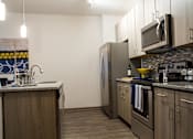 Thumbnail 3 of 44 - Kitchen at The Strand, Oviedo, FL, 32765