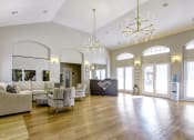 Thumbnail 17 of 29 - a large living room with couches and chairs and a reception desk at Diamond  Trail Apartments, Oklahoma