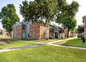 Thumbnail 24 of 29 - our apartments have a spacious courtyard with trees and grass at Diamond  Trail Apartments, Oklahoma City, 73112