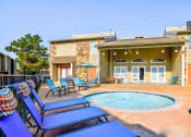 Thumbnail 20 of 29 - the private pool and jacuzzi in the backyard of a house at Diamond  Trail Apartments, Oklahoma City, Oklahoma