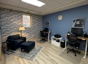 Thumbnail 36 of 50 - Seating area and desk in new business center