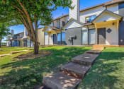 Thumbnail 39 of 40 - a group of houses with stairs in the grass at Diamond Ridge Townhomes, Oklahoma City, OK  