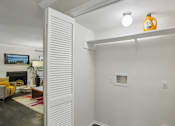 Thumbnail 30 of 32 - A room with a white wall and a small window.