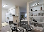 Thumbnail 11 of 22 - A modern kitchen with a glass dining table and chairs.