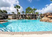 Thumbnail 1 of 22 - A large swimming pool at 2400 Briarwest Apartments, Houston, Texas