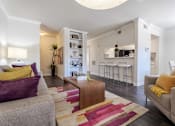 Thumbnail 7 of 22 - A living room with a grey couch and a wooden coffee table.at 2400 Briarwest Apartments, Houston, Texas