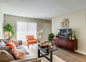 Thumbnail 8 of 26 - Living Room With TV at The Reserve at City Center North, Houston, TX