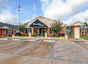 Thumbnail 12 of 14 - Clubhouse Exterior at Willow Oaks, Bryan, Texas