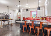 Thumbnail 19 of 25 - Clubroom Kitchen and Dining Room with Stools and Chairs  at Legacy Brooks, 78223