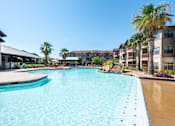 Thumbnail 8 of 25 - Legacy Brooks Swimming Pool with Palm Trees  at Legacy Brooks, 78223