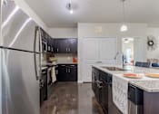 Thumbnail 17 of 25 - Kitchen Island with Stainless Steel Appliances and Cabinetry  at Legacy Brooks, 78223