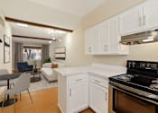 Thumbnail 6 of 25 - Kitchen with white cabinetry.at San Xavier Casitas, Tucson, AZ