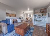 Thumbnail 4 of 11 - Living room with a couch and a coffee table  at Riverstone, Texas, 77802