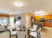 Thumbnail 1 of 15 - a living room and dining room with a glass table and chairs