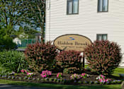 Thumbnail 1 of 18 - Sign at Hidden Brook Apartment Homes Apartments, New Bedford, MA, 02740