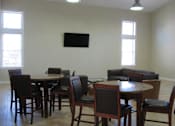 Thumbnail 7 of 18 - Chair and table at Hidden Brook Apartment Homes Apartments, Massachusetts
