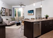Thumbnail 66 of 85 - A modern kitchen with dark wood cabinets and stainless steel appliances.