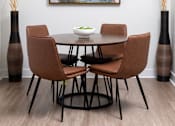 Thumbnail 60 of 85 - A modern dining room with a round table and chairs.
