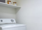 Thumbnail 81 of 85 - A white dryer is sitting in a laundry room.